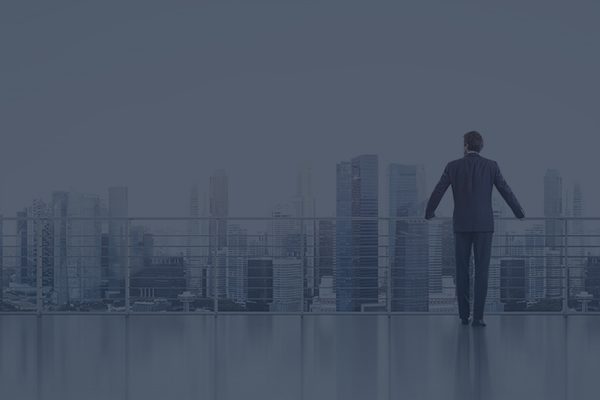 Man Overlooking a City Skyline
