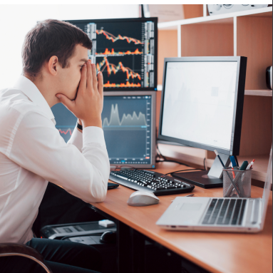 Man looking at computer screen worried